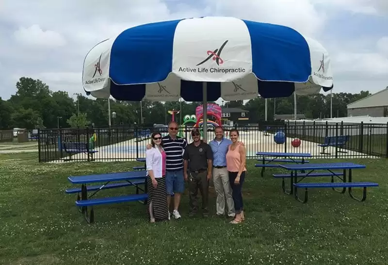 Blue and white shade umbrella at park picnic area Anchor Industries