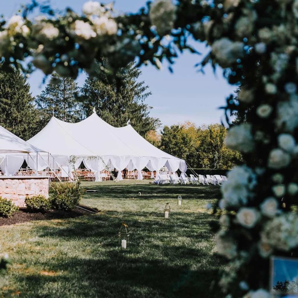 Anchor Industries white high peak tents at outdoor wedding reception