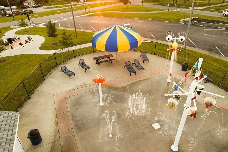 Yellow and blue shade umbrella at children’s splash pad Anchor Industries