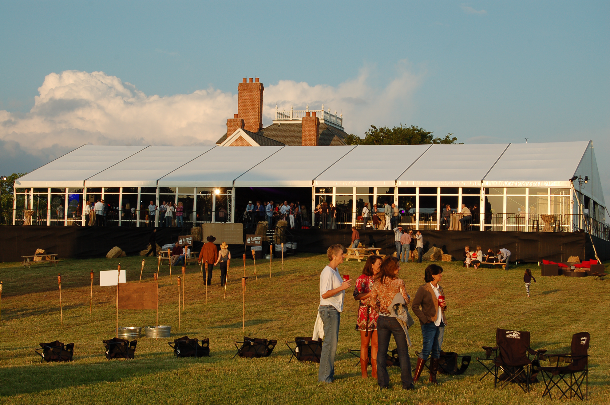 Outdoor community event under Anchor Industries clear span tent