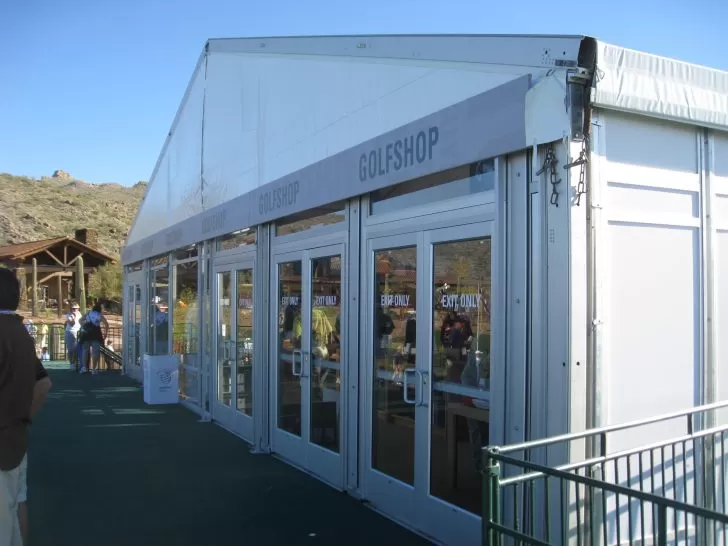 Large event tent with glass doors – commercial-style tent structure with transparent side panels and doors.