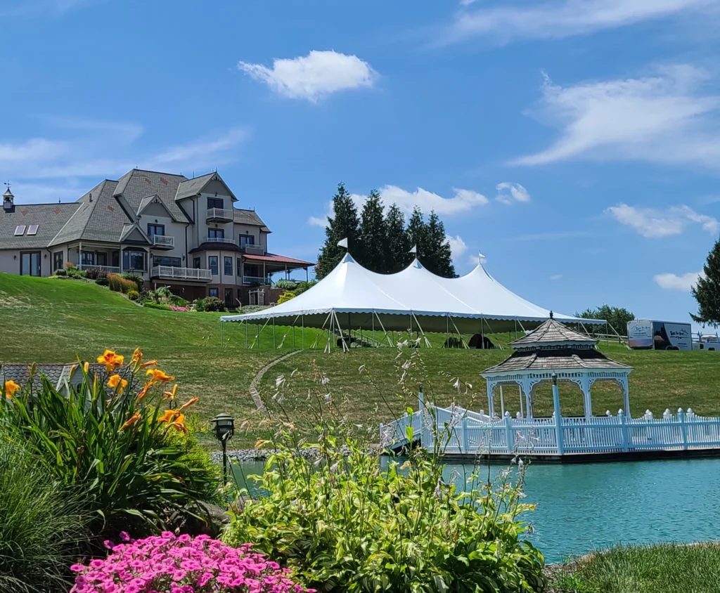 White high peak pole tent at luxury estate by Anchor Industries