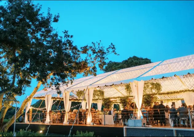 Luxury clear top tent with wood frame used for outdoor dining