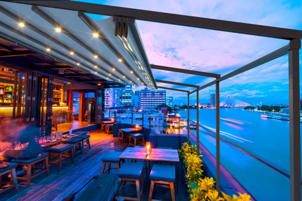 Anchor shade structure and pergola setup with integrated lighting for a high-end restaurant patio space.