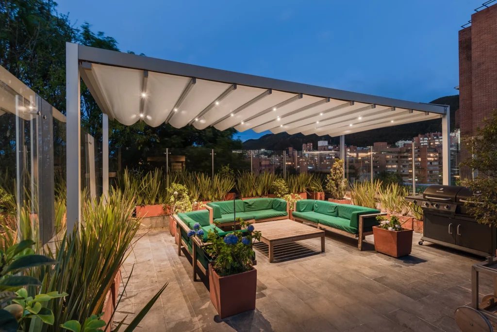 Luxury poolside lounge area featuring an Anchor louvered pergola