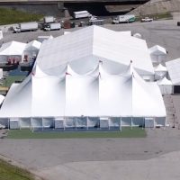 Rental company replacing a worn tent top with new fabric from Anchor Industries before the next event season.